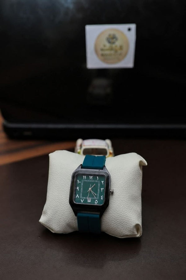 The Emir — square green dial watch with teal strap