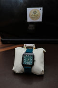The Emir — square green dial watch with teal strap